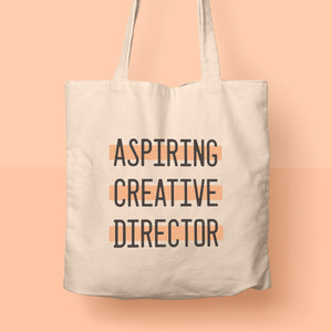 aspiring creative director tote bag